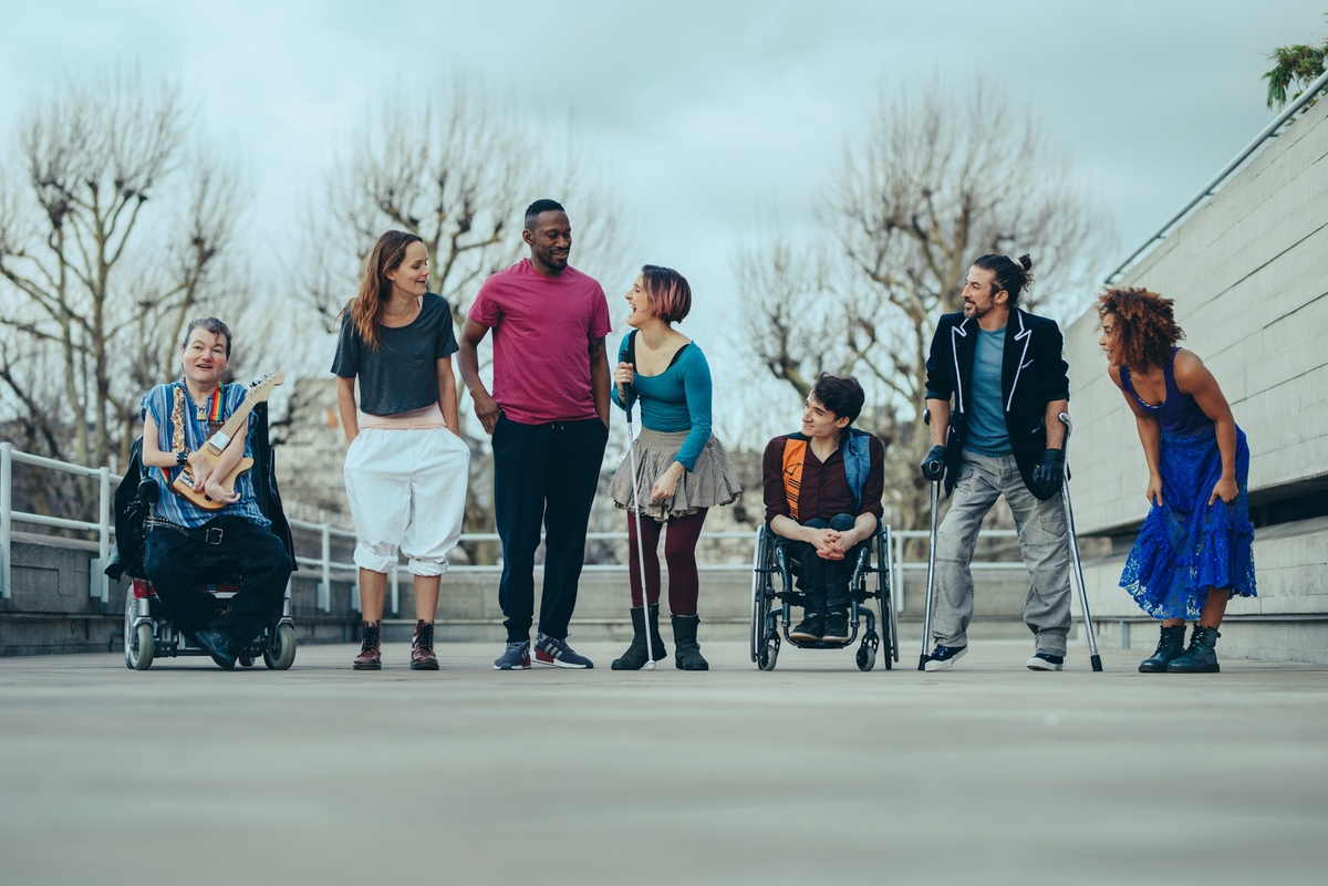 The cast for 'What am I Worth' stand in a line: John, Aislinn, David, Amelia, Johnny, Dergin and Alfa. They are all looking at each other and laughing.